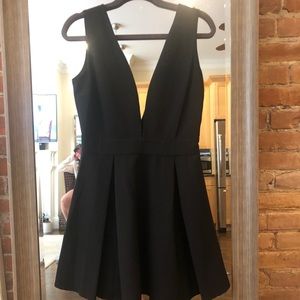 NWT Black low cut mini dress. Bloomingdales
